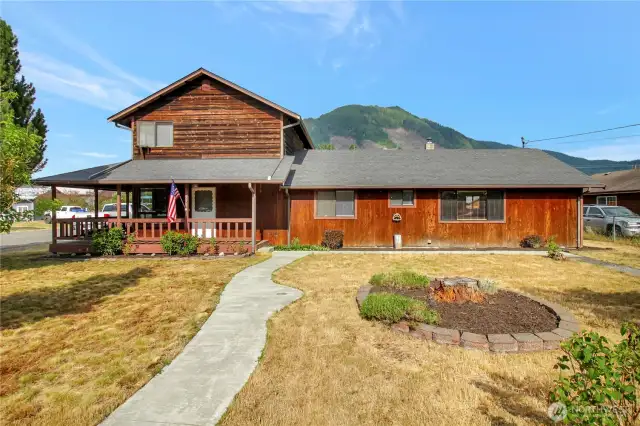 Large farmhouse style home with large porch and easy access to the front door!