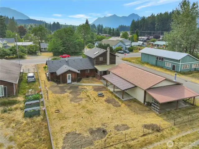 Backyard facing west. Shop entrance and back porch!