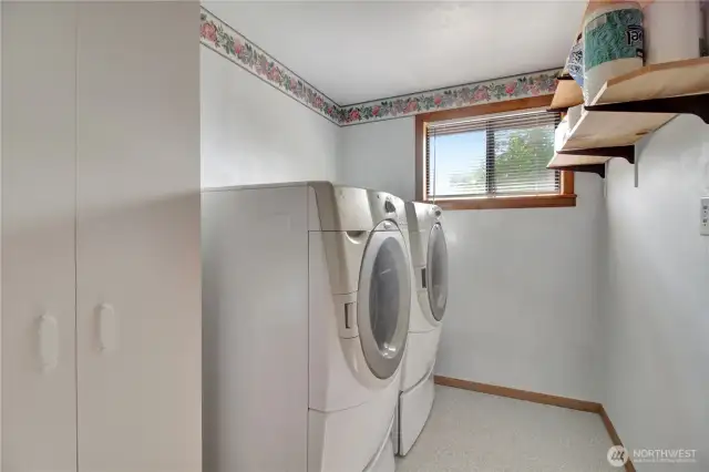 Utility room with laundry directly across from the downstairs bathroom.
