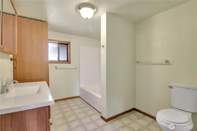 Downstairs bathroom. spacious, clean and ready for your own touches.