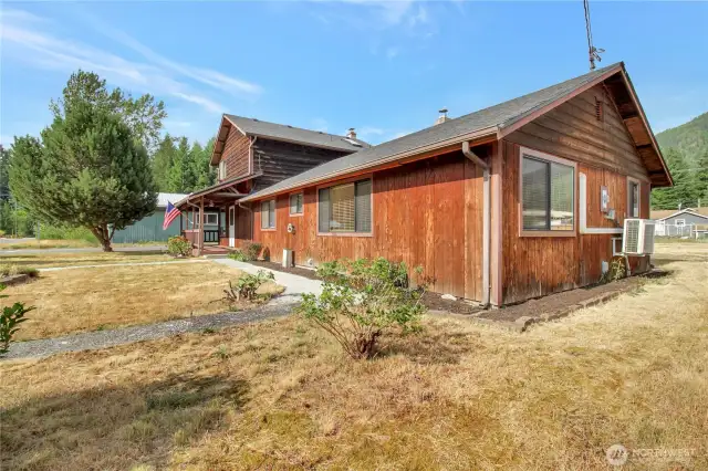 Side yard with access to the backyard and front street parking.