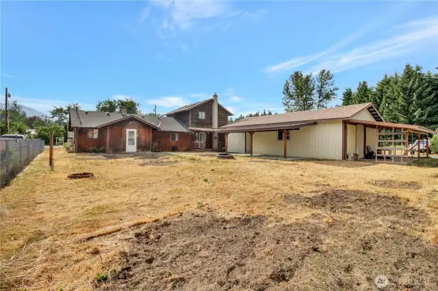 Backyard facing west! plenty of sunshine and could be a wonderful garden space!