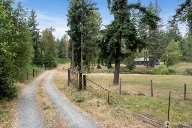 Down a quiet country road, behind the gate, your dream hideaway begins.