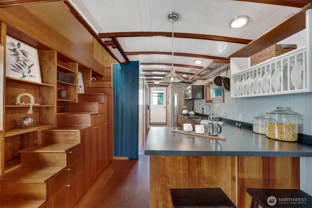 Room for a small dining room, but also this pennisula is a great way to enjoy the eat-in kitchen.