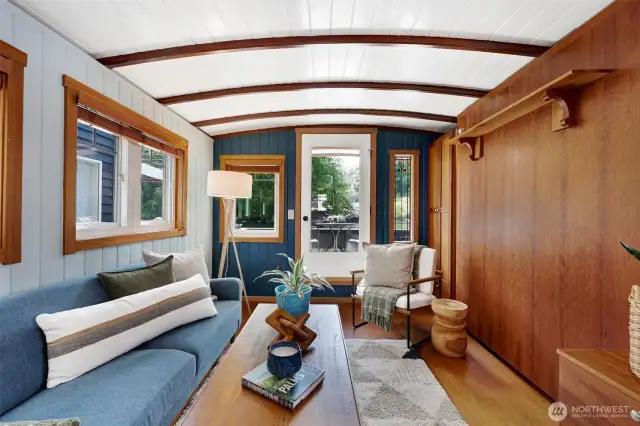 The living room has a functional Murphy bed option (pictured here on the right) for guests staying over.