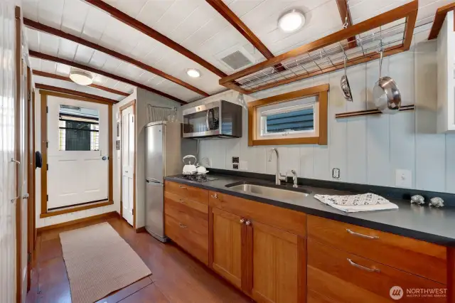 There is a good size coat closet/storage closet to the right of the front door in this photo.