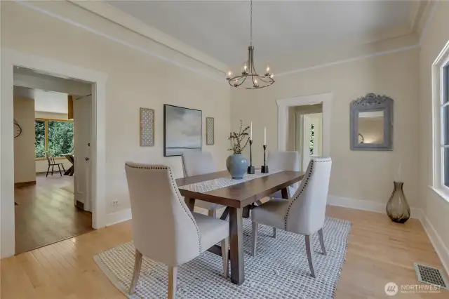 Dining looking into kitchen & breakfast nook. Doorway to right leads to bedroom, bath, stairway to upstairs.