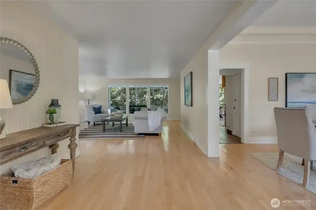 From the entry: main level living room, dining to right & kitchen through hallway.  Main level bed & bath to right, past dining room.  Slider to deck from kitchen.