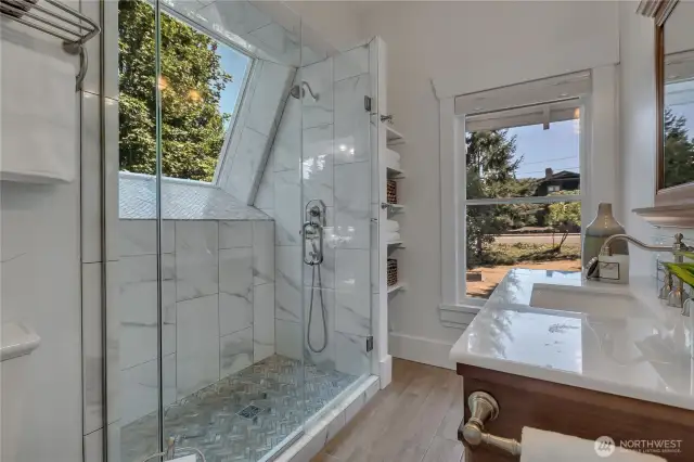 New primary/second floor bath.  Oversized shower; quartz topped vintage vanity; storage; toilet to left, just out of sight.
