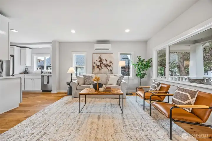 Seamless open floor plan with tons of natural light bursting into living and kitchen.