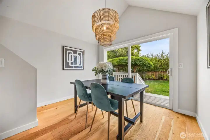 Soaring vaulted dining room ceiling provides a light and airy space which leads to beautiful backyard with custom pizza oven and spacious deck.
