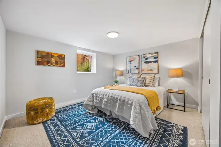 One of two bedrooms located on lower floor offers tons of natural light.