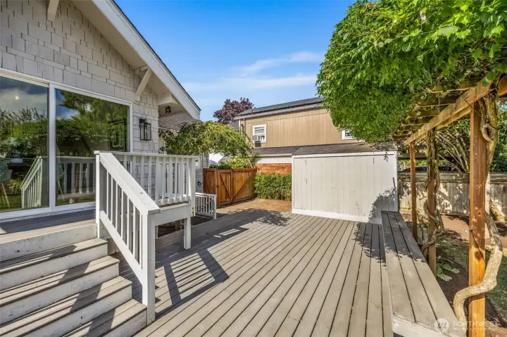 Sprawling deck just off dining room with plenty of places for garden, pets or play!