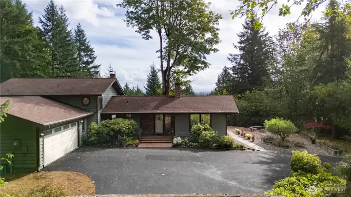 2506 Sq Ft Tri-level home on 7.5 Acres on Bush Mountain.  Such a great home!!  The front entrance has a brick porch & steps, on the right hand side of home you will find box planters & a fire pit.