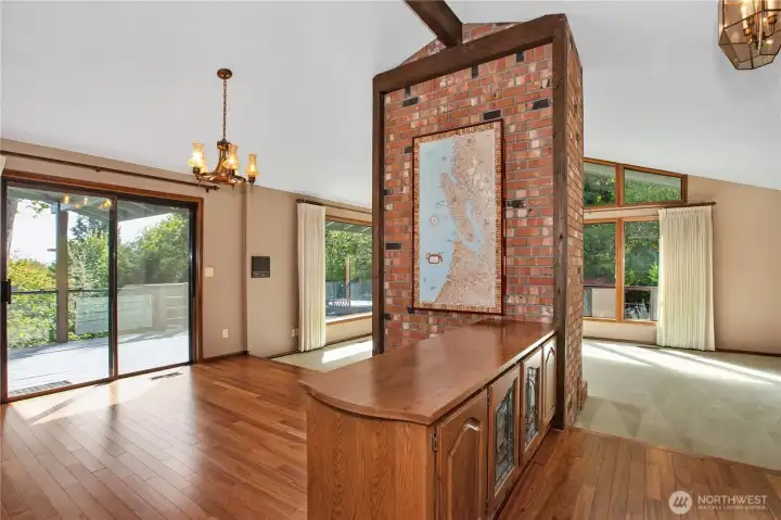 Another view of dining room with slider going to the large deck. Floors are Canary hardwood, beautiful!!