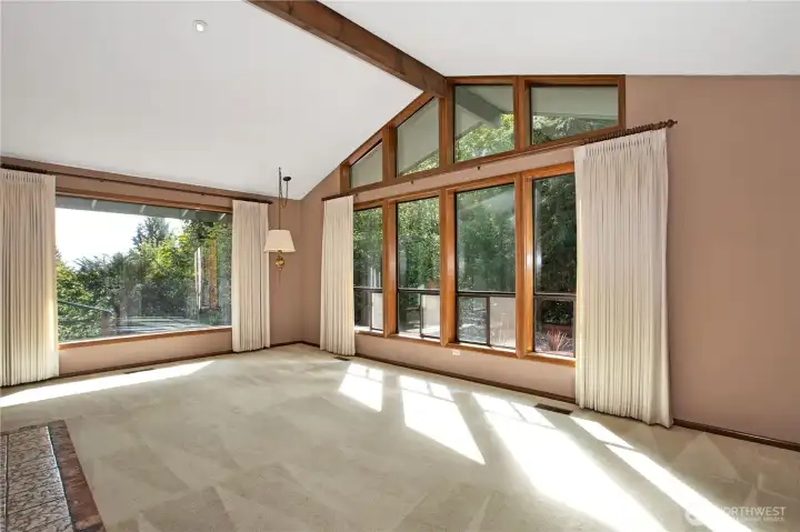 Another view of living room, with big picture window that looks out towards the back portion of the property.