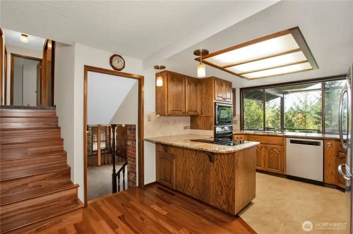 Kitchen has brand new stove top, granite counters, newer appliances with windows to take in wildlife and territorial views.