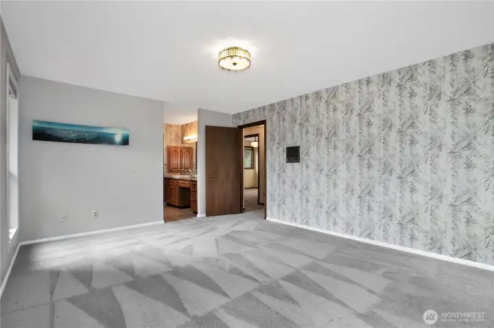 Another view of primary with primary bathroom & walk-in closet