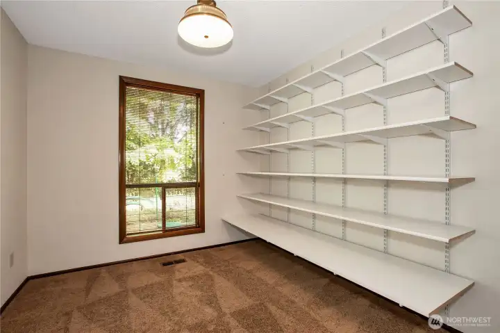 Behind the french doors is a room that was used for storage/craft room