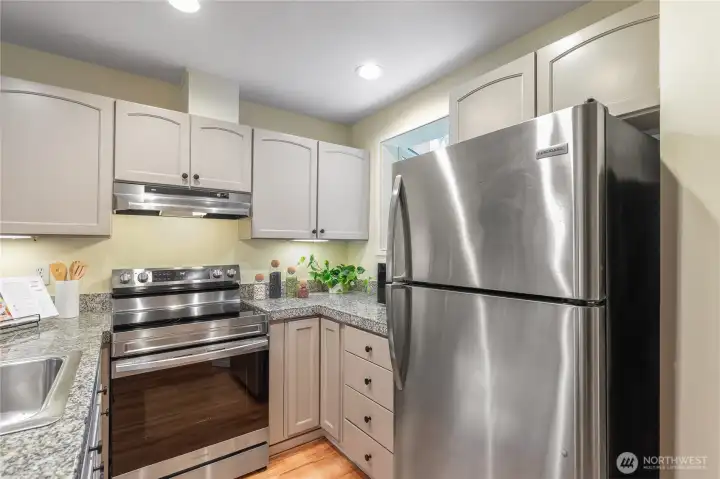 Updated kitchen appliances and ample cabinets
