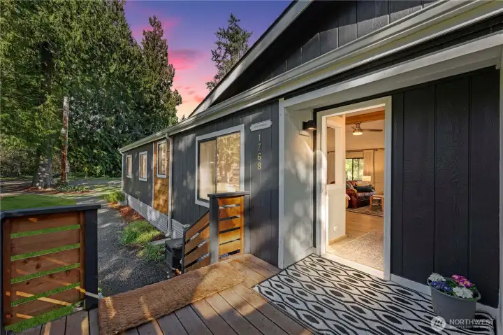 Welcoming front deck with room for furniture.