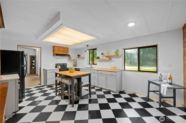 Spacious eat-in kitchen with generous counter space.