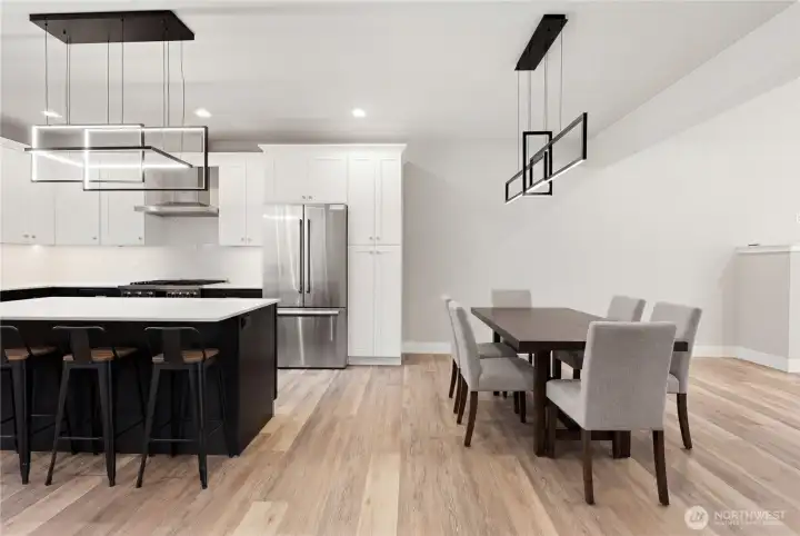 Amazing flow in this floorplan! You have a large dining area right off of the kitchen, which also flows into a covered outdoor living space.