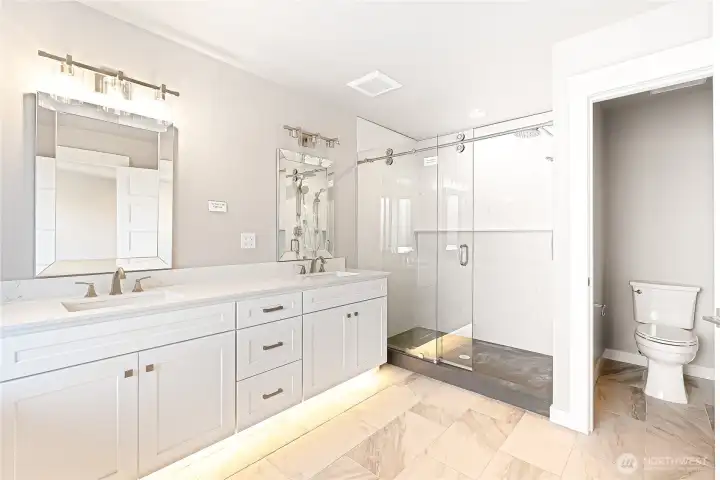 And a separate shower, which is also made up of one piece solid quartz slab and a one piece solid quartz pan, easy to clean, with glass shower doors, make this a spa like retreat.