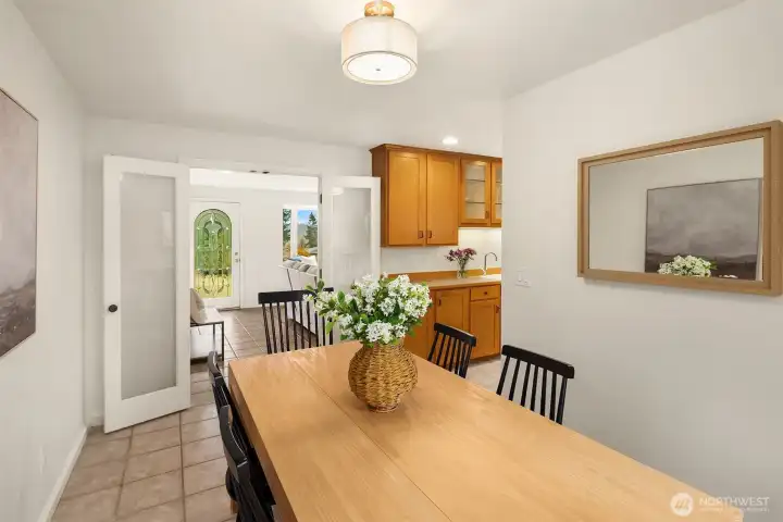 French doors can be used to close off the dining room, kitchen and family room from the rest of the house.