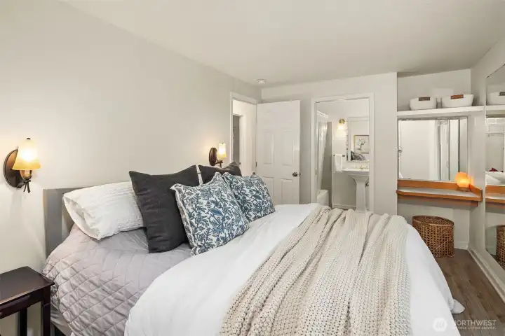 Primary bedroom with ensuite bathroom and built-in vanity.