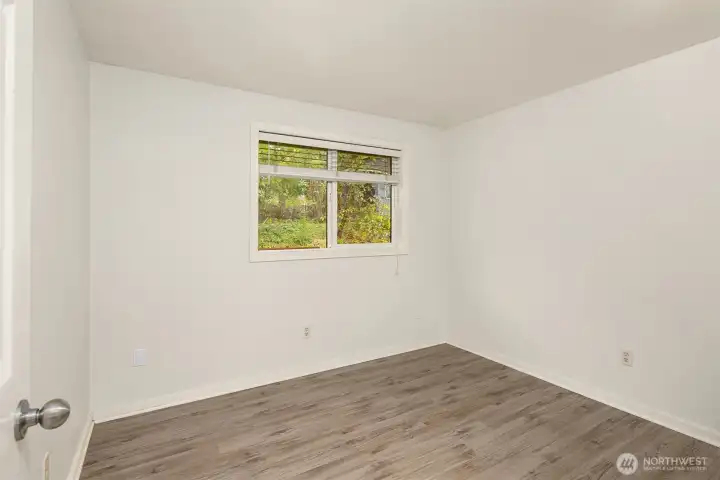 Bedroom #5 looks out to the back yard.