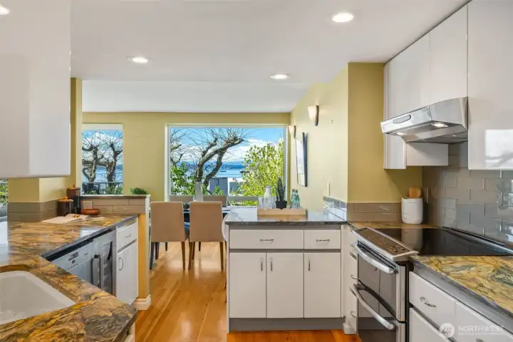 Granite countertops, stainless steel appliances and a wine fridge included in the kitchen.