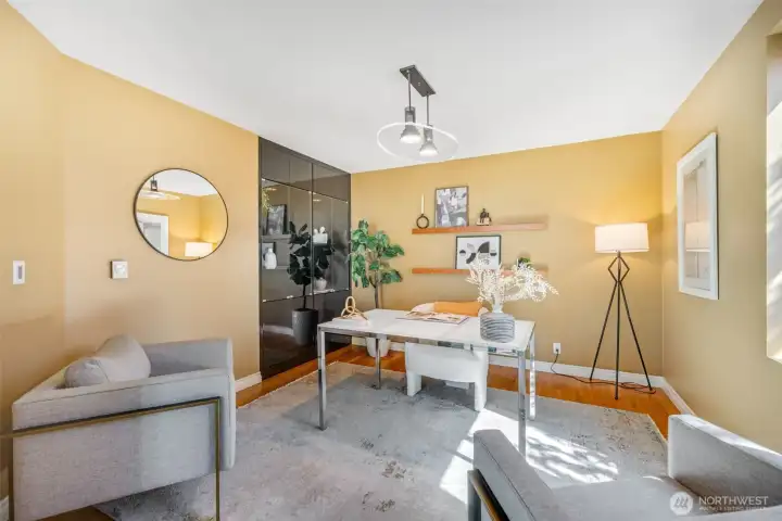 The space has a built-in display closet and the hard wood floors run in this room. Great office, library or gym.