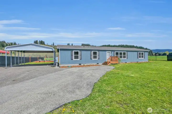 Large driveway with two car carport.