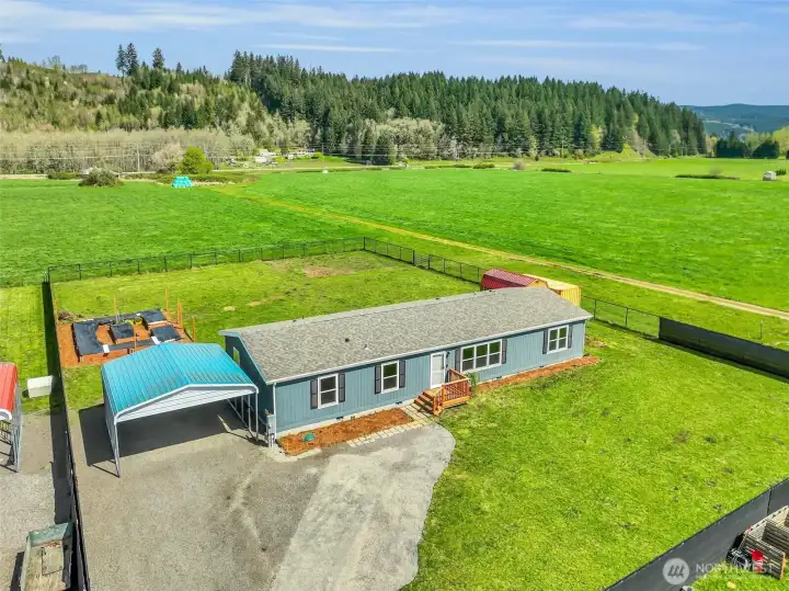 Raised Garden boxes behind the carport.