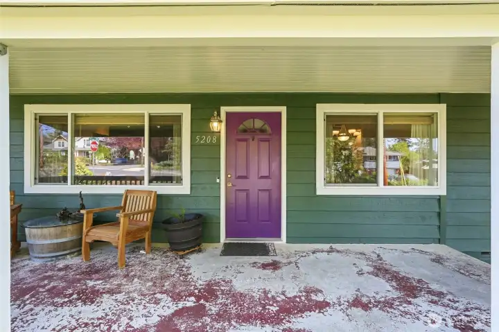 Covered front entry with custom color door adds character and a welcoming touch.