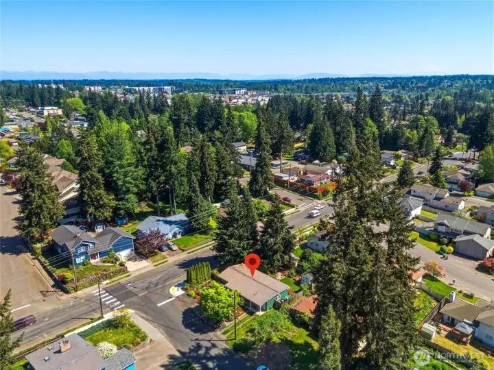 Bird’s-eye view showcasing the home’s position on a spacious corner lot within a well-established neighborhood.