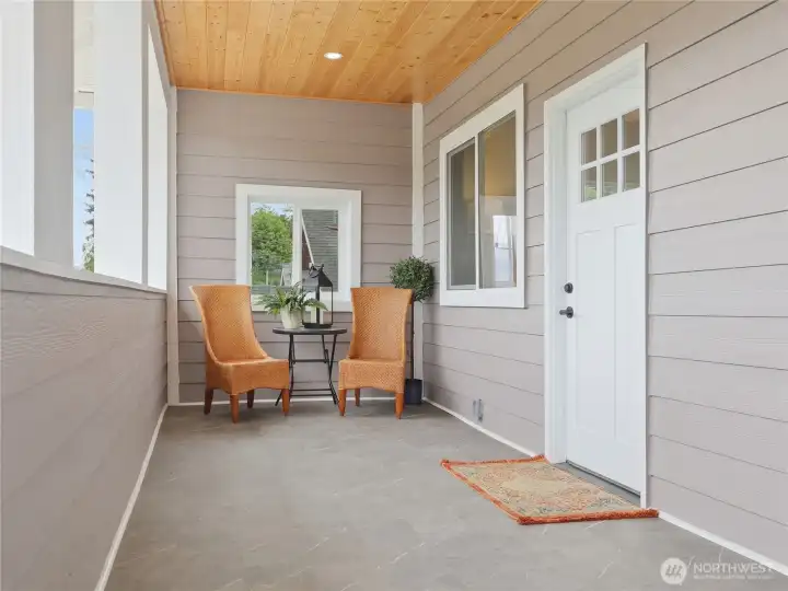 Covered outdoor sitting on front porch