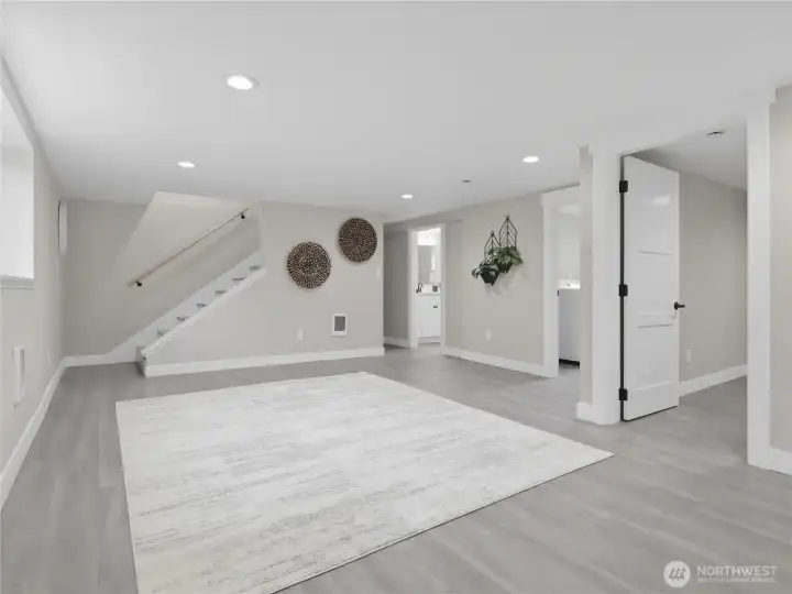 The spacious ground floor doubles your living space with a second family room, two bedrooms, a private office, a full bath, and laundry. Ideal for multi-generational living, guests, or a massive flex space.
