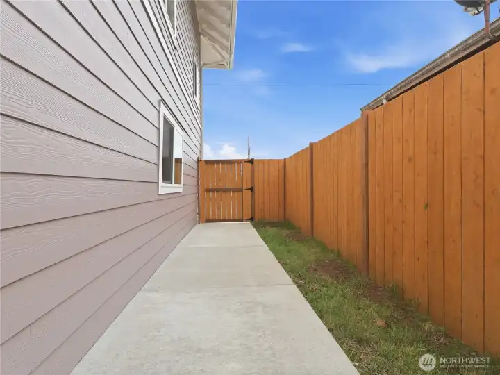 Front to back side entrance through gate and to downstairs side door.