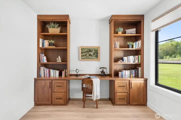 Built in Walnut cabinetry. Pull out drawers and shelves with a large window to enjoy nature while you work.