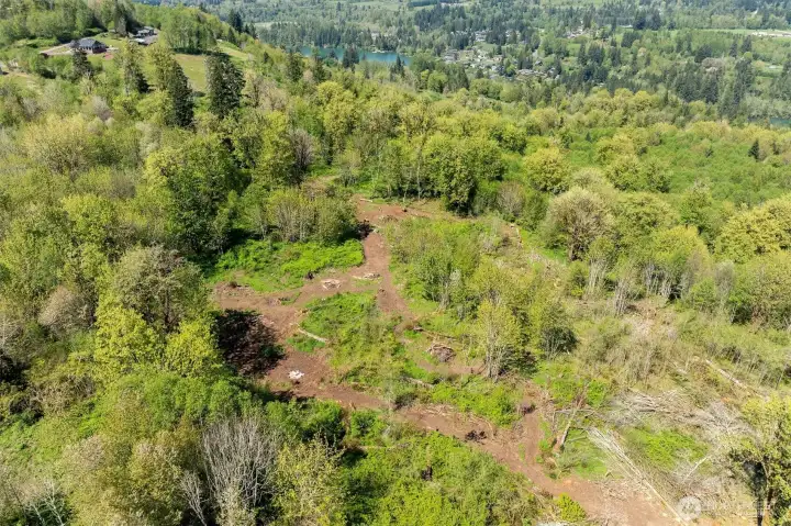 Cleared walking trails to the back of the property.  There is a cleared area for benches and a firepit.