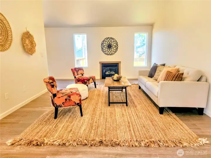 Upstairs vaulted living area features a cozy gas fireplace.
