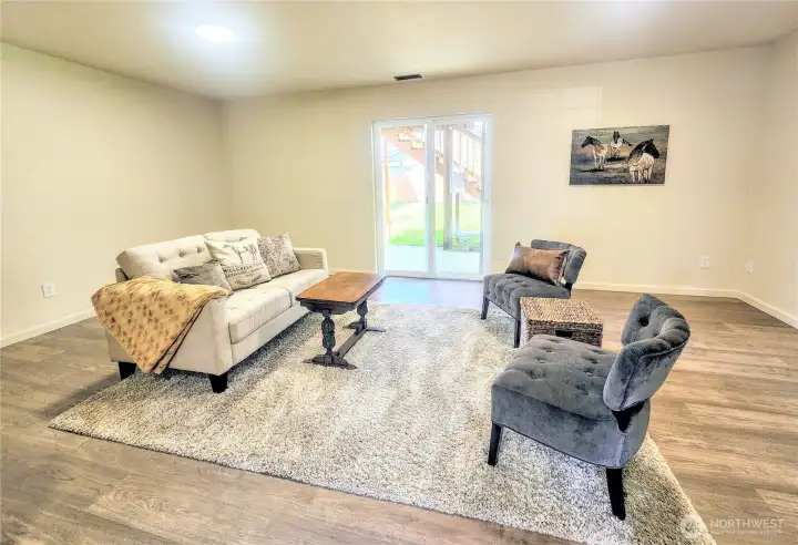 Downstairs bonus space exits to back yard.