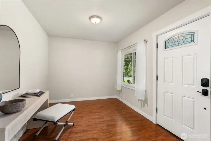 Welcoming foyer inside the home's east/covered porch entrance