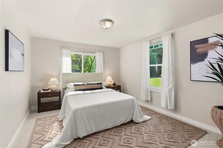 Primary bedroom in southeast corner of home