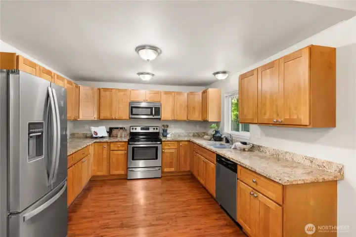 Large kitchen features tons of storage, and the refrigerator stays!
