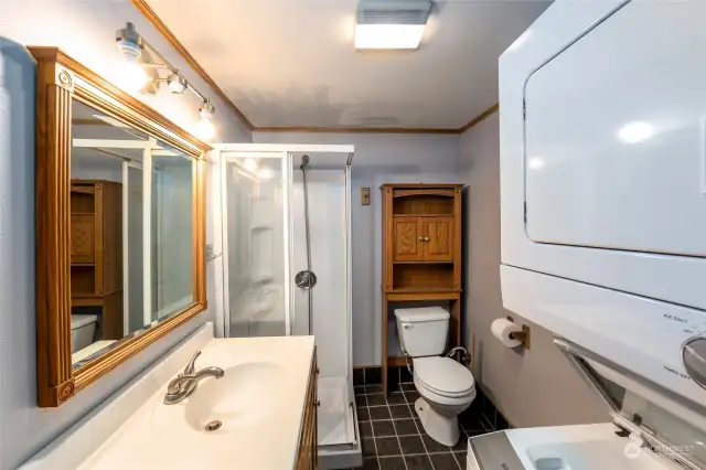Shower and laundry bathroom in studio