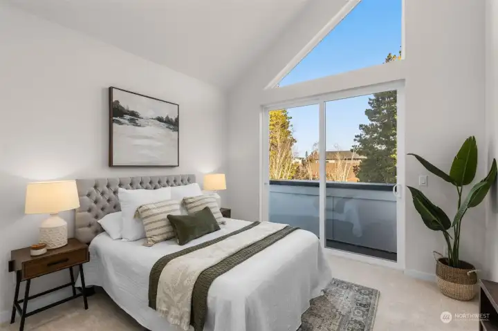 Top-floor bedroom with vaulted ceilings and plenty of space for rest and recharge.
