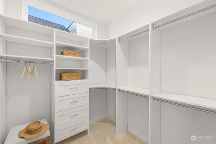 Dream closet with built-in organization and a skylight that keeps it bright and inviting.